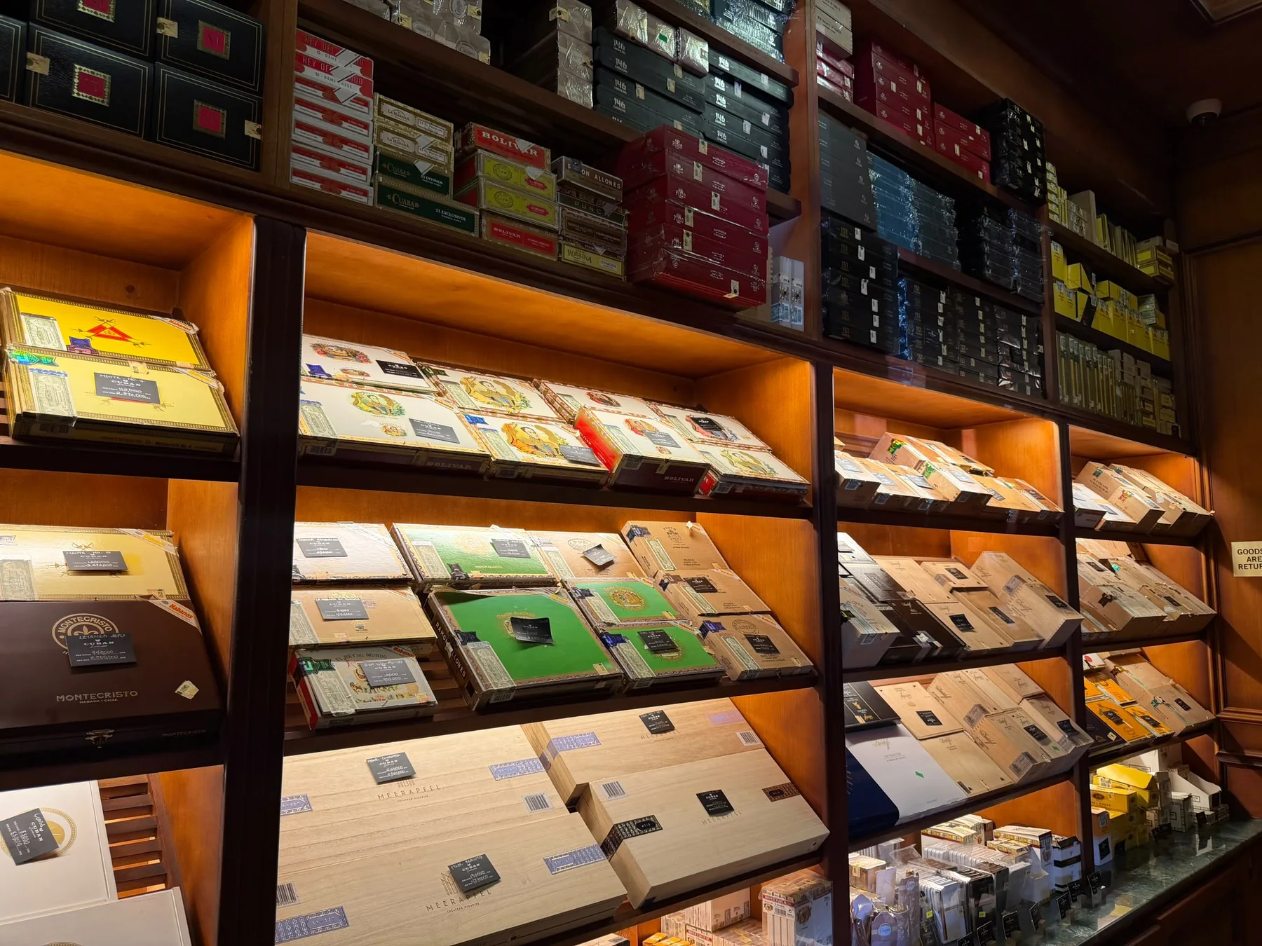 Cuban Exclusive humidor wall stocked with cigar boxes